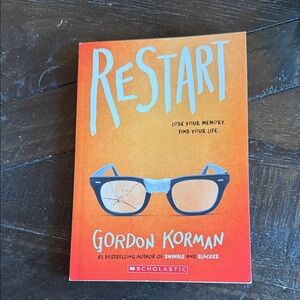 Scholastic Orange 'Restart' Book with Glasses Design